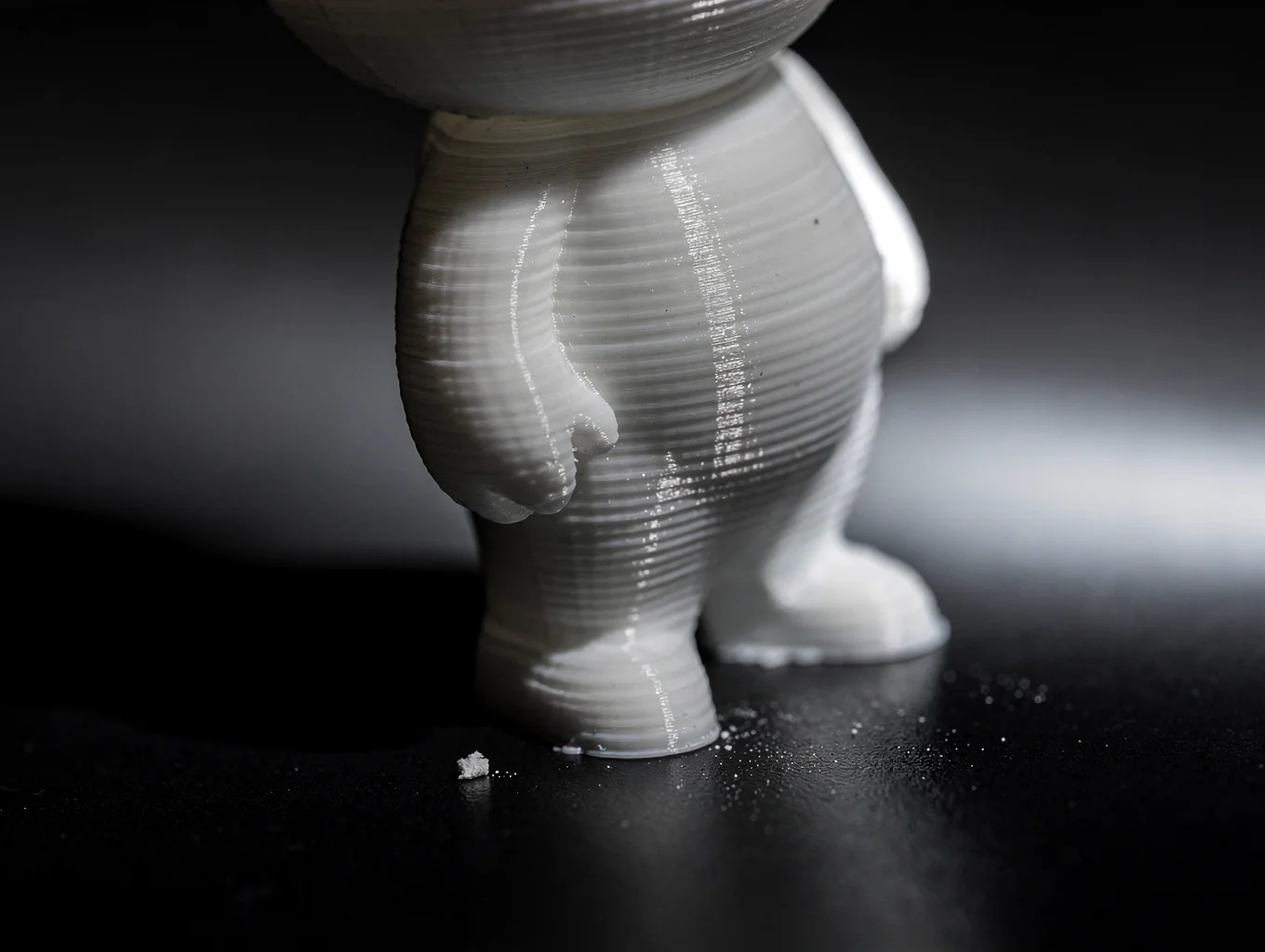 Macro detail of multi-layer tampo printing on custom PVC figure faceplate